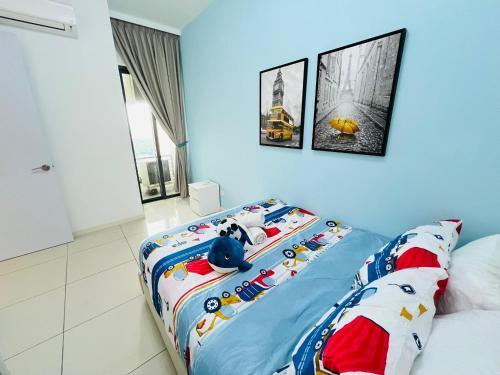 a bedroom with a bed with hello kitty bedding at ELYSIA-Near Gleaneagles & Legoland-2RB WarmQ Suite Max7pax-WaterDispenser in Nusajaya