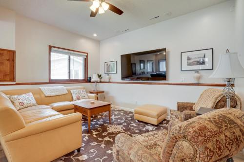 a living room with a couch and a table at Spacious Minneapolis Home Rental 8 Mi to Downtown in Minneapolis