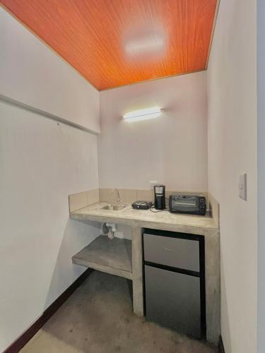 a bathroom with a sink in a room at Hotel Citadin Z10 in Guatemala