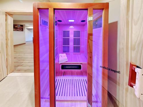 a pink elevator in a room with purple walls at Fortune Mountain Retreat in McHenry
