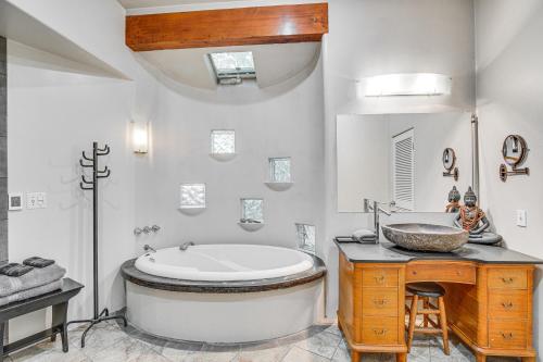 a bathroom with a large tub and a sink at Gig Harbor Home Large Deck, Outdoor Dining Area in Gig Harbor