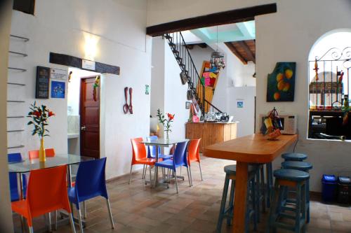 a restaurant with a table and chairs in a room at Mi Llave Hostels Cartagena in Cartagena de Indias