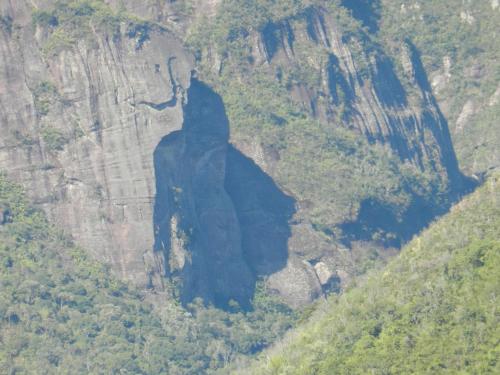 a mountain cliff with a shadow on it at Morada do Guardião - Soldados Sebold in Barracão