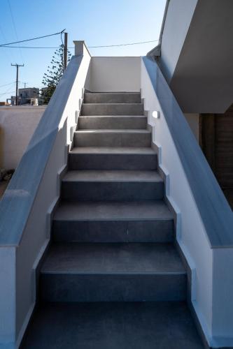 a set of stairs leading up to a house at Athina's House in Xerokampos