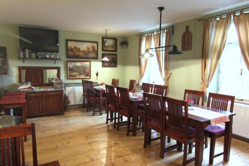 a dining room with a table and chairs at Hotel Stará Pekárna s privátním wellness in Liberec