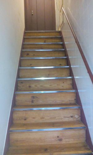 a set of stairs in a hallway with a door at Aliciamar E by Casas de Setúbal in Setúbal