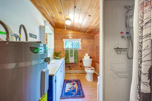 a bathroom with a sink and a toilet in a room at Rustic Cabin with Patio 8 Mi to Kings Canyon Park in Miramonte