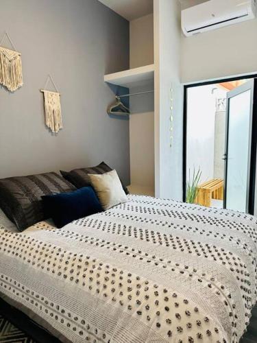 Postel nebo postele na pokoji v ubytování Malecon NEW Casita Victoria