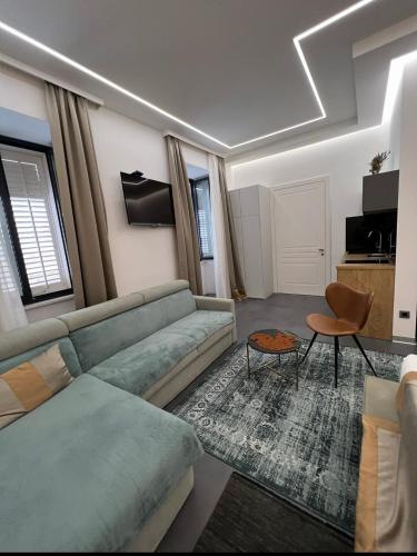 a living room with a couch and a table at Luxury Marina apartments in Rijeka