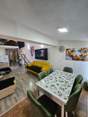 a living room with a table and a couch at Apartments Lakeside City Center in Ohrid