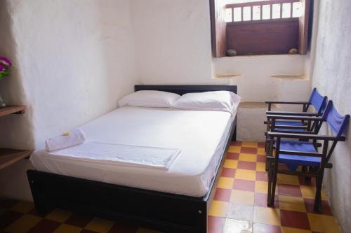 Casa Orquidea Hostal Baricharaにあるベッド