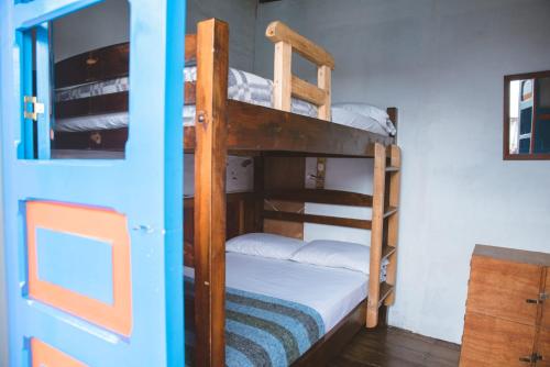 Cama o camas de una habitación en Hostal La Casa De Lili