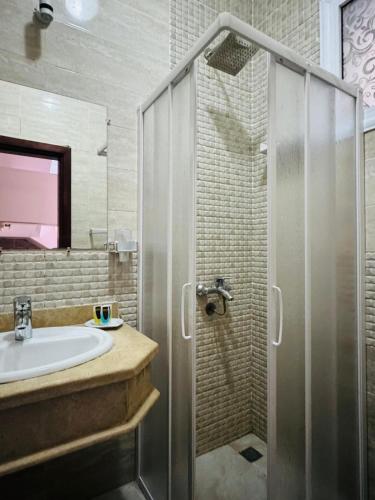 a bathroom with a shower and a sink at Swiss Royal DAHAB in Dahab