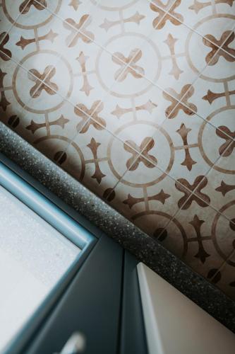 a room with a curtain with crosses on a wall at Casa Rosanna Malta B&B Adults only 16 plus in Marsaskala