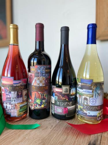 four bottles of wine sitting on a table at Domaine Chardonnay in Temecula