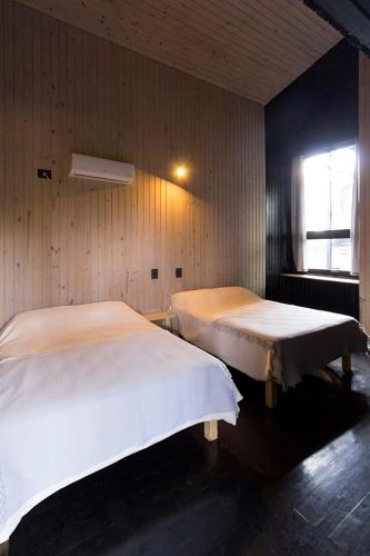 Ένα ή περισσότερα κρεβάτια σε δωμάτιο στο Casa Mbopicua