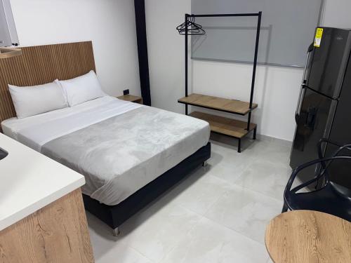 Postel nebo postele na pokoji v ubytování Nook Apartamentos en el corazón de Medellín