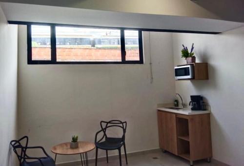 TV a/nebo společenská místnost v ubytování Nook Apartamentos en el corazón de Medellín