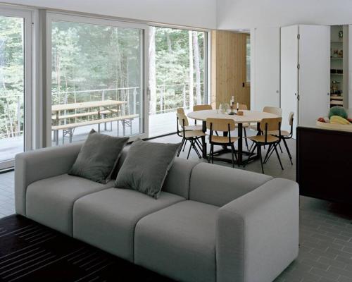 a living room with a couch and a table at Modern Mountain Retreat in Mount Tremper
