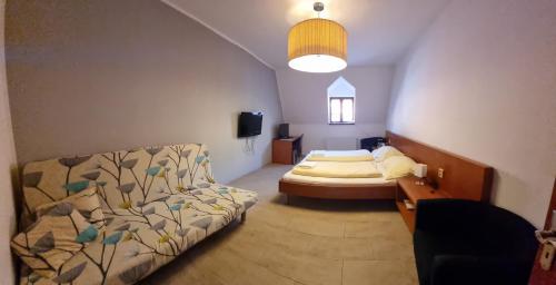 Postel nebo postele na pokoji v ubytování neVINNÉ Apartmány