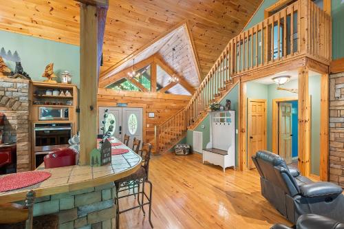 a kitchen and dining room in a log home at Now and Forever cabin in Sevierville