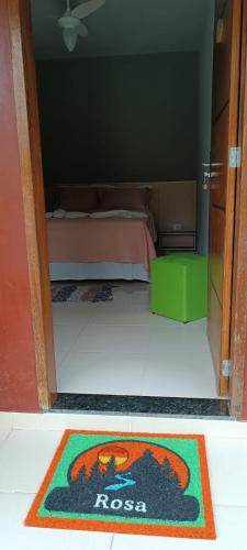 a room with a rug on the floor with a bed at Pousada Sítio da Floresta in Sana