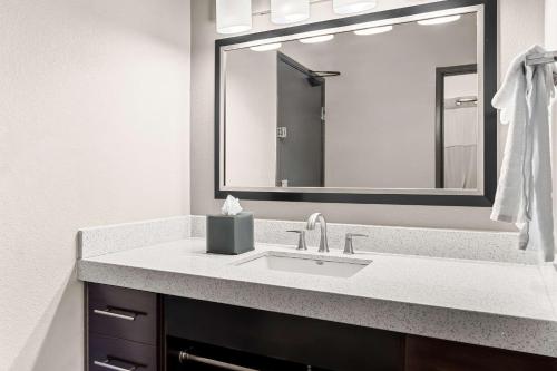 a bathroom with a sink and a mirror at Best Western Plus At Lake Powell in Page