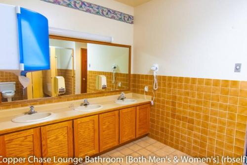 a bathroom with two sinks and two mirrors at Royal Vista II Pool-Spa Ski-in out Gym, Sauna, Laundry, BBQ in Brian Head
