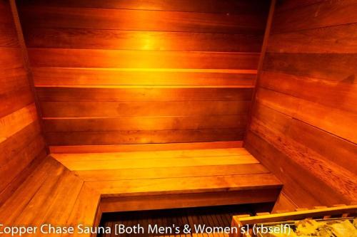a small wooden sauna with a bench in it at Royal Vista II Pool-Spa Ski-in out Gym, Sauna, Laundry, BBQ in Brian Head