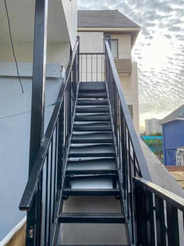 a stairway leading up to a house at Hostal EntreOrientes in Viña del Mar