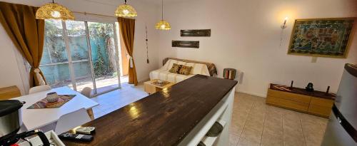 a living room with a large wooden counter top at Mausann Pilar in Pilar
