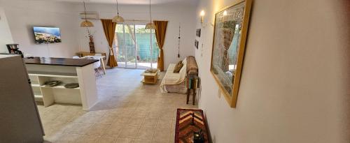 a living room with a kitchen and a dining room at Mausann Pilar in Pilar