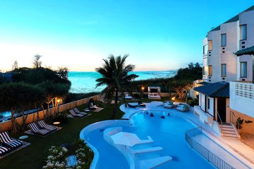 an aerial view of a resort with a swimming pool at La Casa Panacea Okinawa Resort in Onna