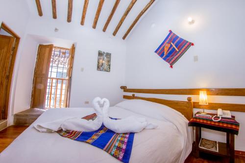 Ein Bett oder Betten in einem Zimmer der Unterkunft Hostal El Grial