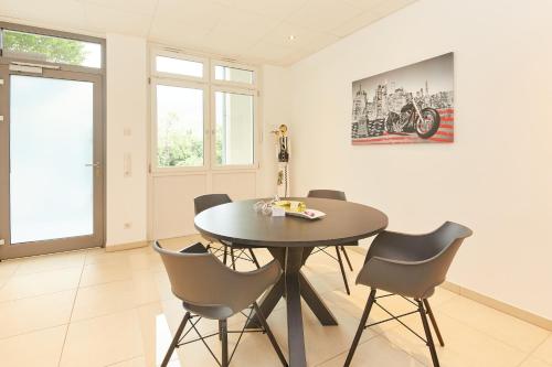 a dining room with a table and chairs at Time Out in Bernkastel-Kues