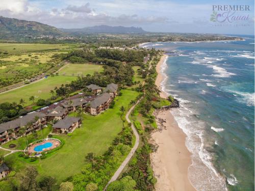 an aerial view of a beach with houses and the ocean at Ocean View at Kaha Lani 310 in Lihue