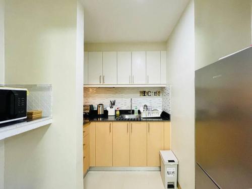 Cuisine ou kitchenette dans l'établissement 16 Cozy and Spacious Studio