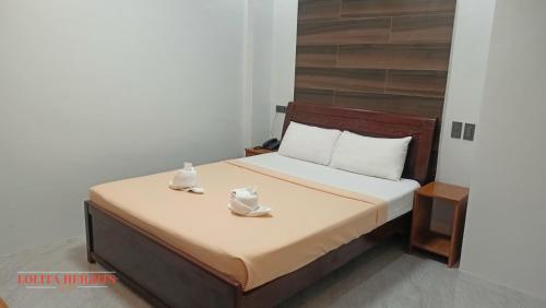 Ένα ή περισσότερα κρεβάτια σε δωμάτιο στο Lolita Heights Hotel
