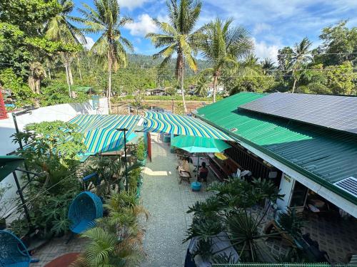an overhead view of a building with umbrellas at Aquarius - Port Barton in San Vicente