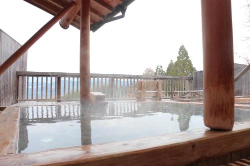 a pool on the deck of a house at Kafutei in Yamaga