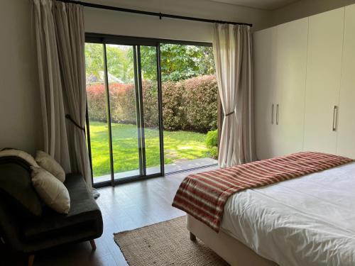 Una cama o camas en una habitación de Villa Exceptionnelle à Anahita