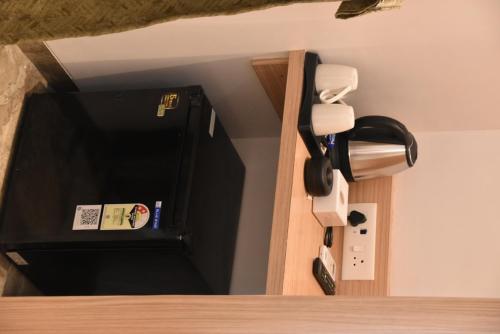 a room with a door with a phone on the wall at Hotel Aarush Inn in Navi Mumbai