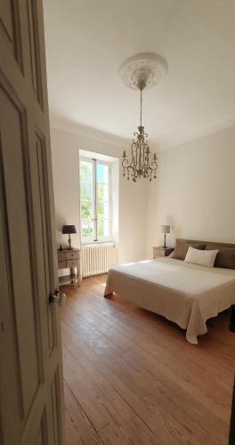 Кровать или кровати в номере Maison d'hôtes La Bastide de Patou