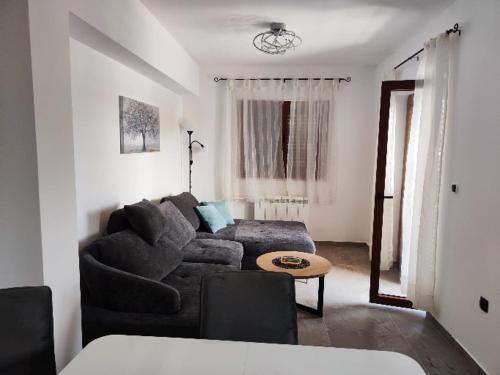 a living room with a couch and a table at Villa Niko in Porat