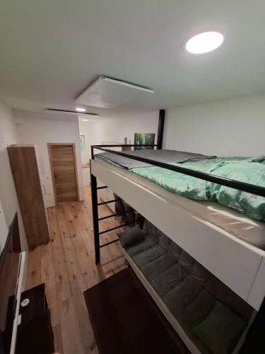 a room with a large bed on top of it at apartma Pohorc - Praprot in Pohorje