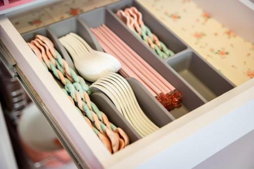 a drawer filled with different types of ties at 春漫小築民宿 in Miaoli