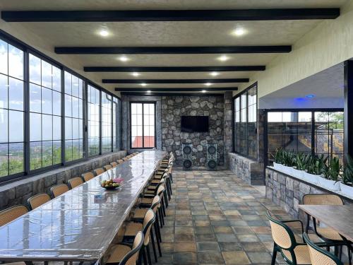 a large conference room with a long table and chairs at Cherry House Ohanavan by Amaranoc am in Oganavan