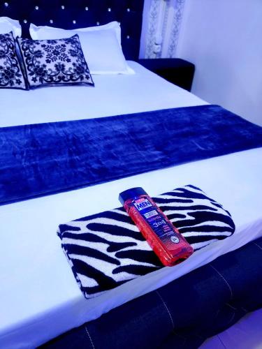 a bed with two beds with towels on it at Mini Studio Meublé venez loger ici in Dakar