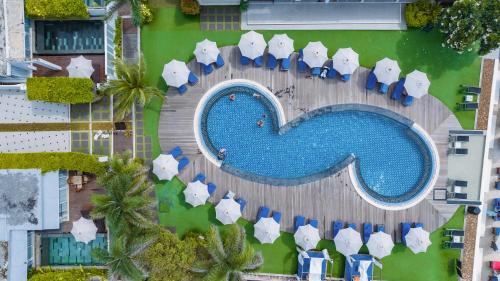 an overhead view of a swimming pool at a resort at KC Beach Club & Pool Villas in Chaweng