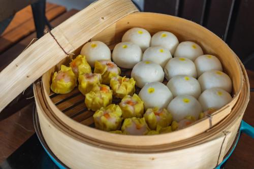a basket full of balls of food with chopsticks at KC Beach Club & Pool Villas in Chaweng